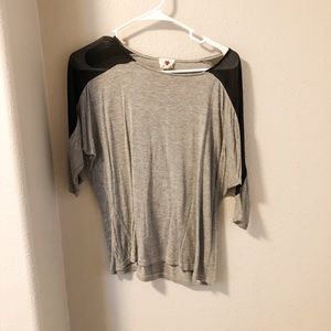Gray t-shirt with black shear shoulders.